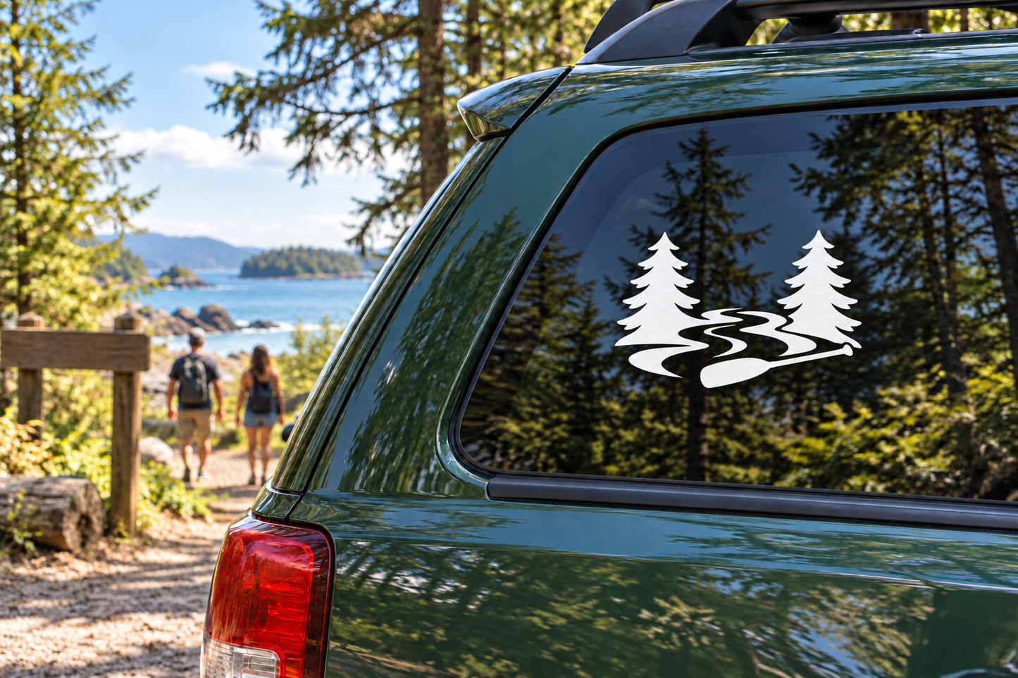 Vinyl decal with two pine trees and a white wavy river on a car window