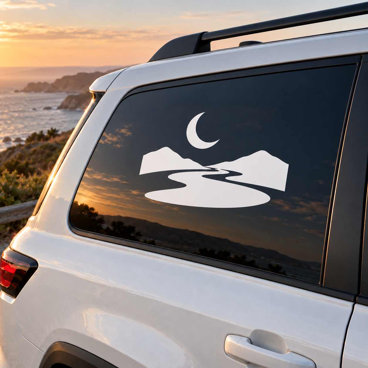 Moonlit rafting river vinyl decal on car window in white and black