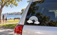 Rainbow cloud vinyl decal with arched stripes on car rear window glass