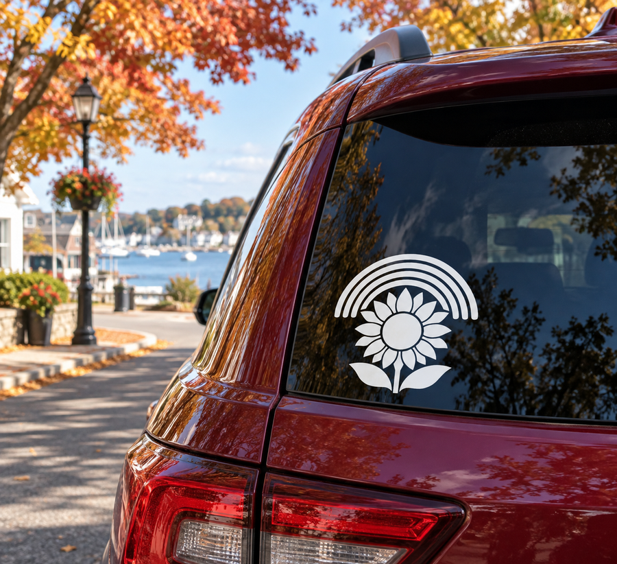 Sunflower rainbow vinyl decal on car rear window, white flower with arched rainbow above