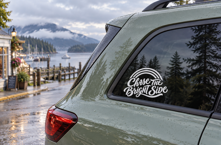 Vinyl decal on car window: “Chase The Bright Side” script in white with black outline.