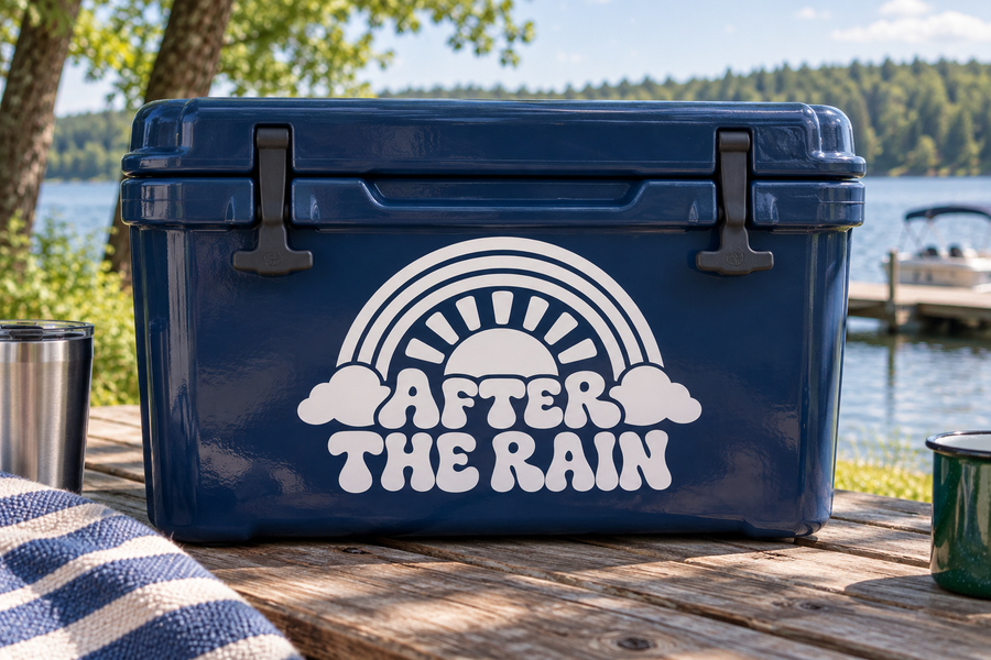 Rainbow vinyl decal reading “After the Rain” with sunburst, clouds