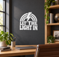 Black and white vinyl wall decal with lightning bolt and “Let the Light In”