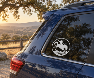 Rodeo rider crest vinyl decal, circular cowboy-on-horse silhouette on car window