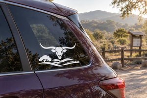 Vinyl decal of black longhorn head with ranch landscape for car window