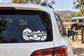 White vinyl car decal with cowboy hat, oak tree, and ranch landscape on window