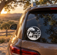 Round ranch horse crest vinyl decal on car rear window, white border and black graphic.