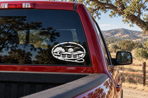 Scenic oval vinyl decal, black-and-white landscape with lasso loop on car window