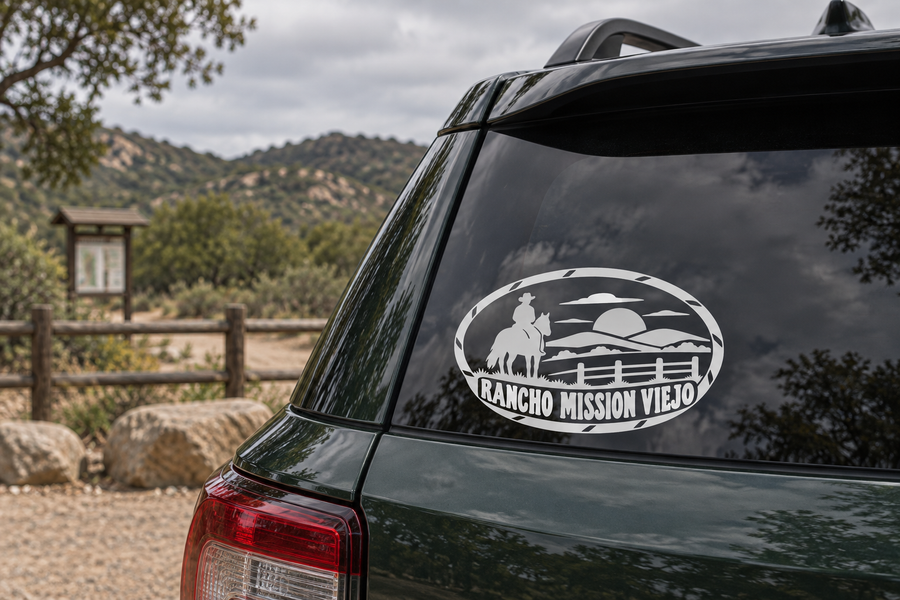 Oval Rancho Mission Viejo vinyl decal on vehicle rear window, black and white.