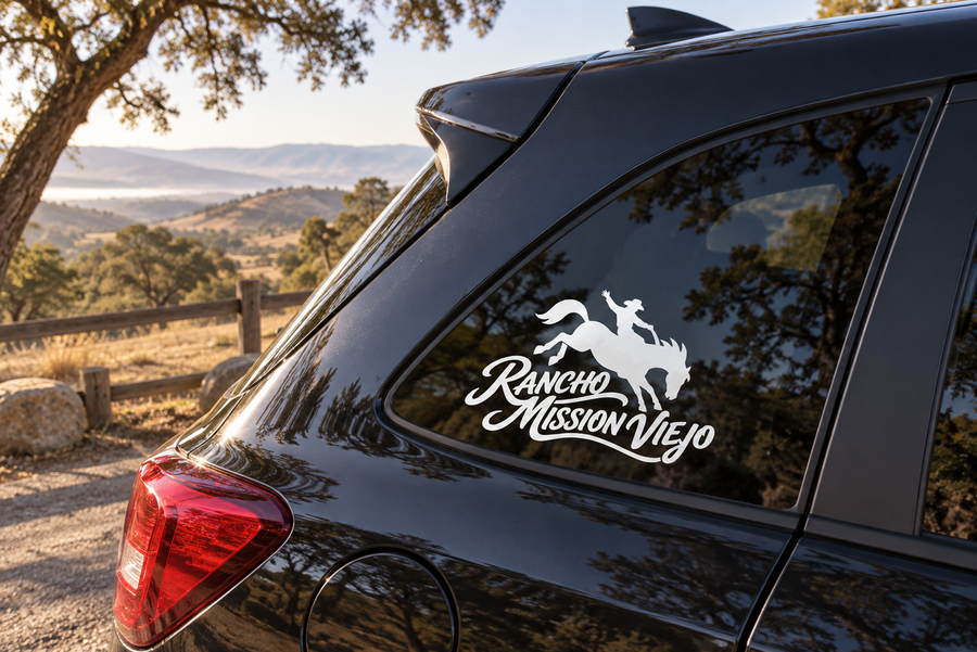 Vinyl window decal with Rancho Mission Viejo lettering and cowboy on horseback