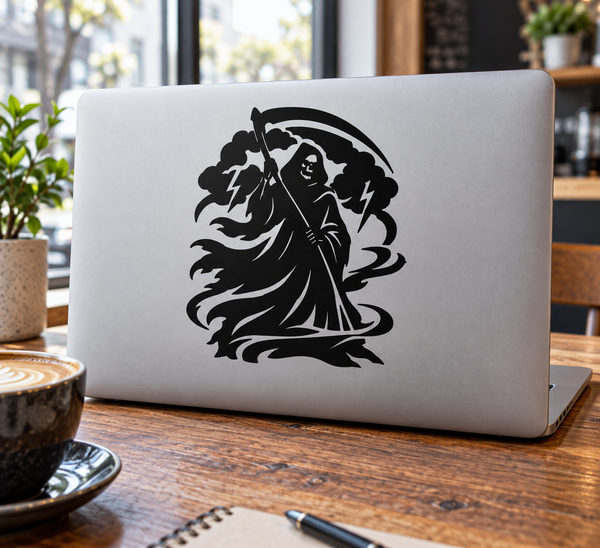 Black emblem vinyl decal featuring reaper with scythe, applied on laptop lid