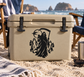 Black reaper-themed vinyl decal on beige cooler lid