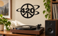 Black 420 peace-orbit vinyl decal on a wall, circular peace symbol with orbit rings