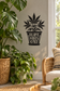 Black vinyl decal of cannabis leaves with "PLANT VIBES ONLY" text in a pot