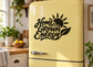 Black Home Grown Energy vinyl decal with sunburst icon on refrigerator door