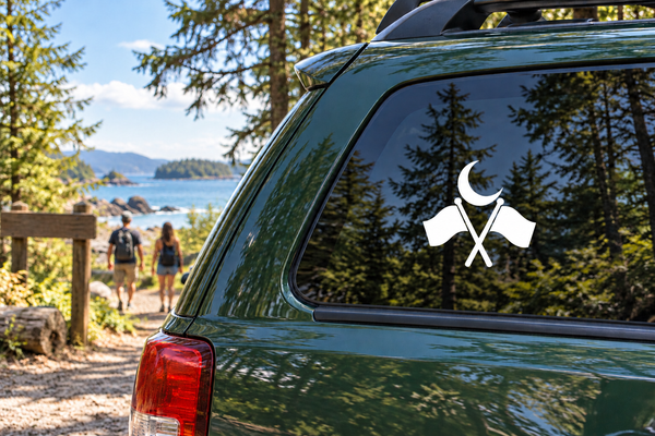 Referee vinyl decal with crescent moon and crossed batons on car window