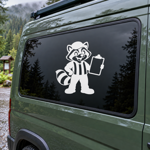 Raccoon referee vinyl decal with striped uniform and clipboard on dark backing