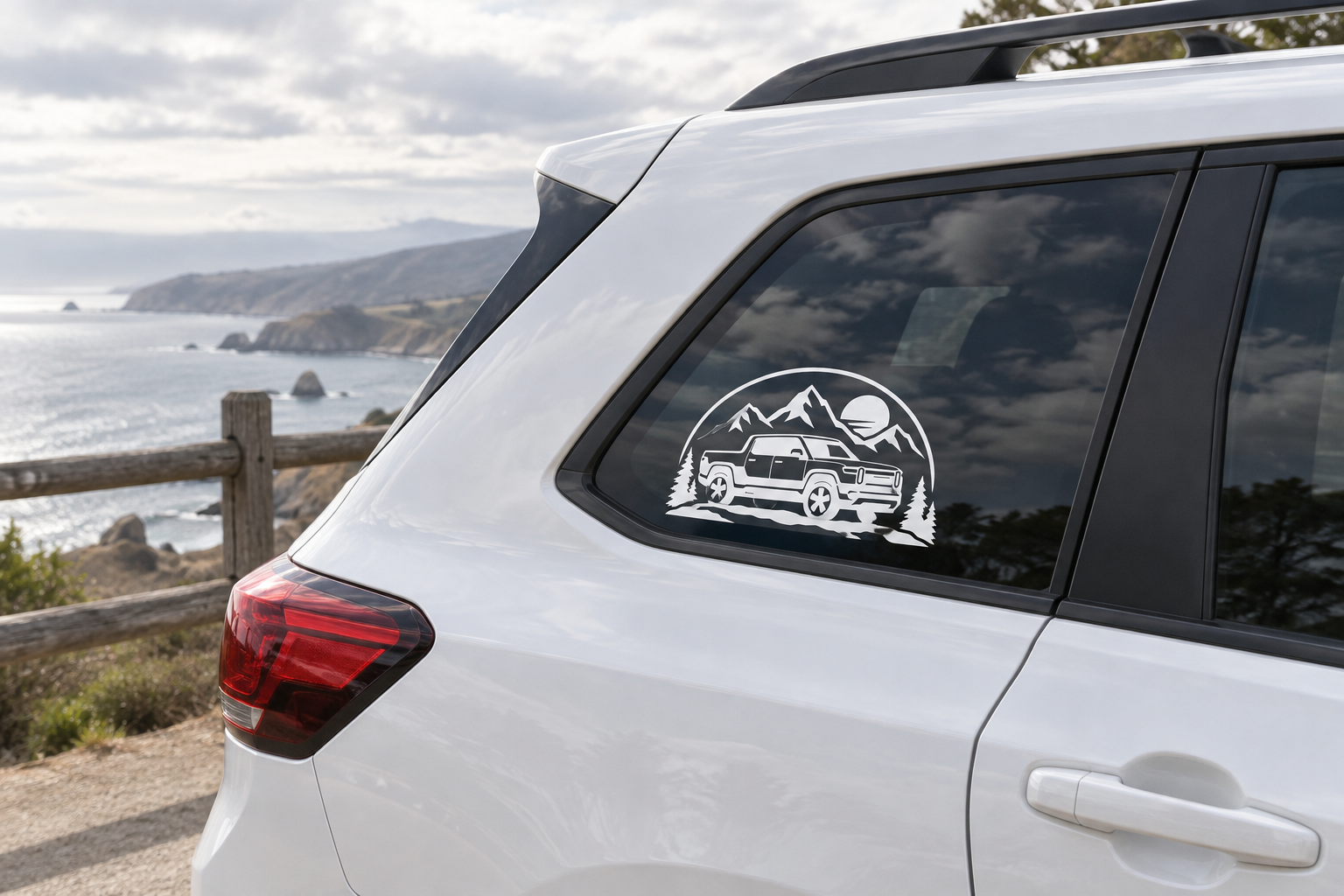 Vinyl mountain road decal on vehicle side window with off-road truck in a circle logo