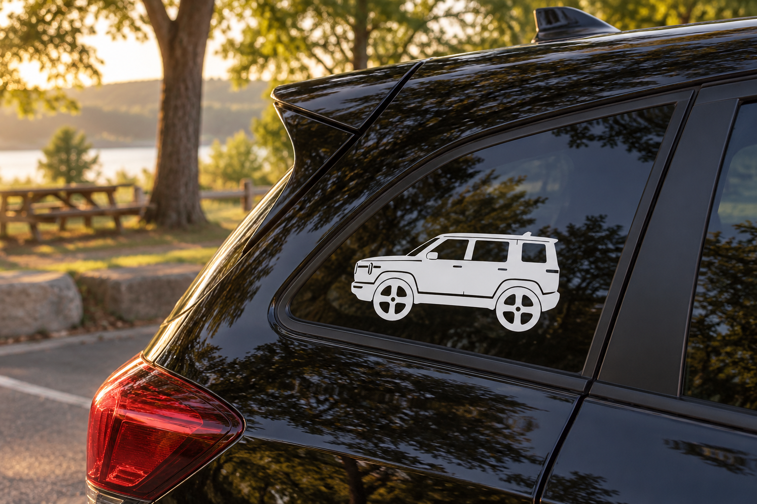 Rivian R2 side profile vinyl decal with white SUV graphic on car window