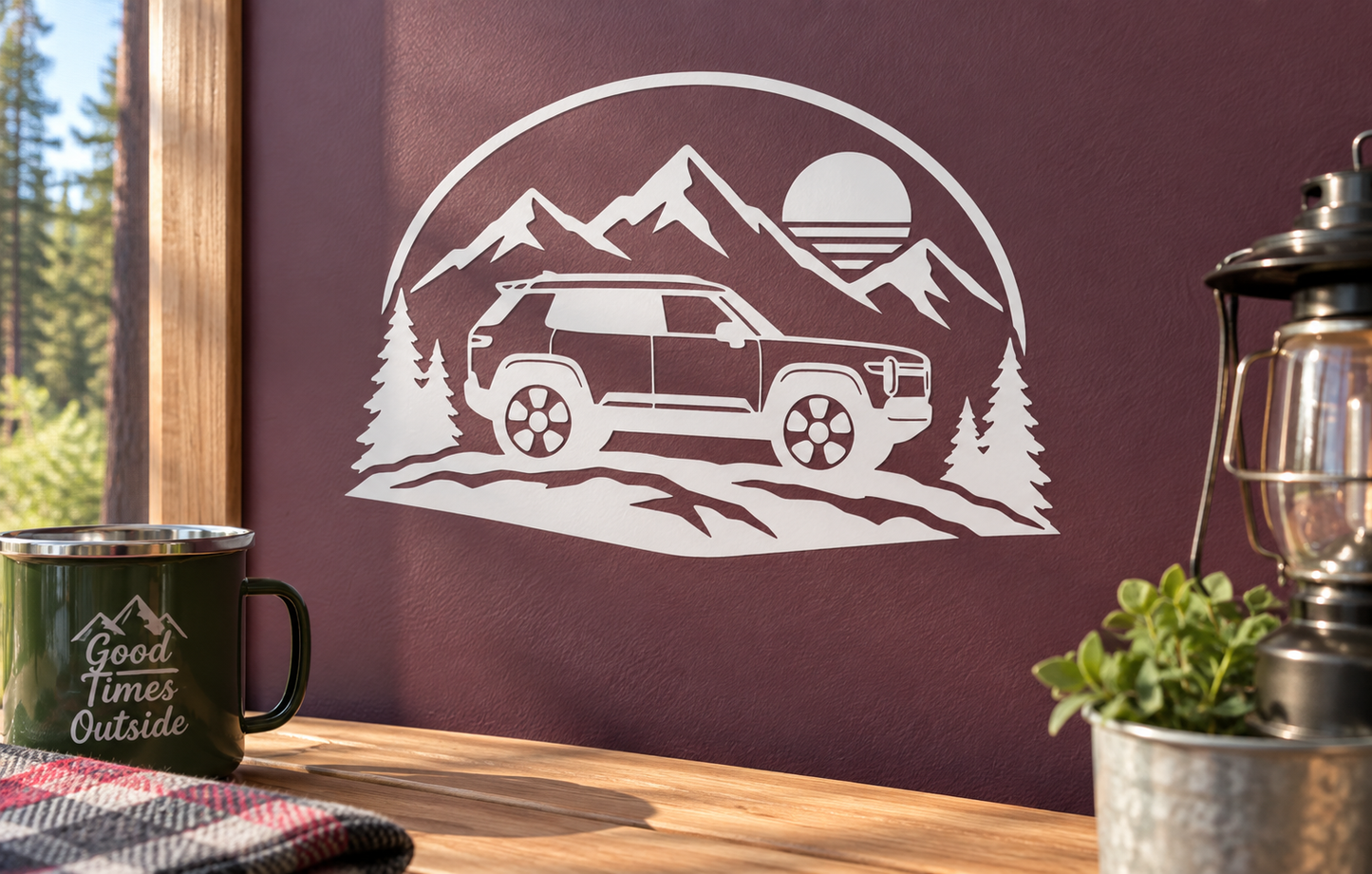 Vinyl decal of off-road vehicle with mountains, pine trees, and rising sun circle