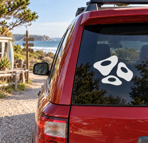 Rock climbing hold vinyl decal trio: three black holds with white oval centers.
