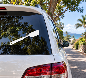 White climbing grip brush vinyl decal on car rear window glass
