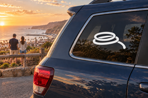 Vinyl decal of a rock-climbing rope coil emblem on a car rear window