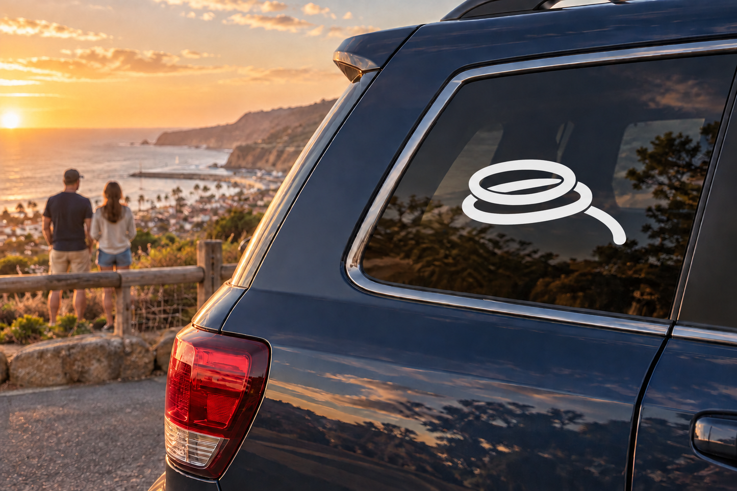 Vinyl decal of a rock-climbing rope coil emblem on a car rear window