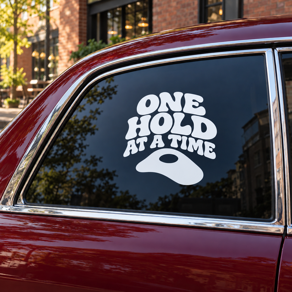 Vinyl rock climbing decal: "ONE HOLD AT A TIME" with climbing hold icon