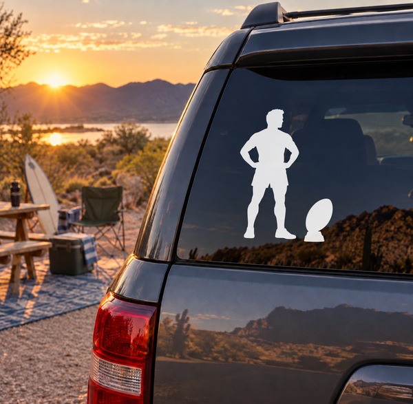 Rugby player vinyl decal silhouette on car window, white figure with ball
