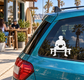 Rugby half-time bench vinyl decal of a seated player on a bench, white on car glass