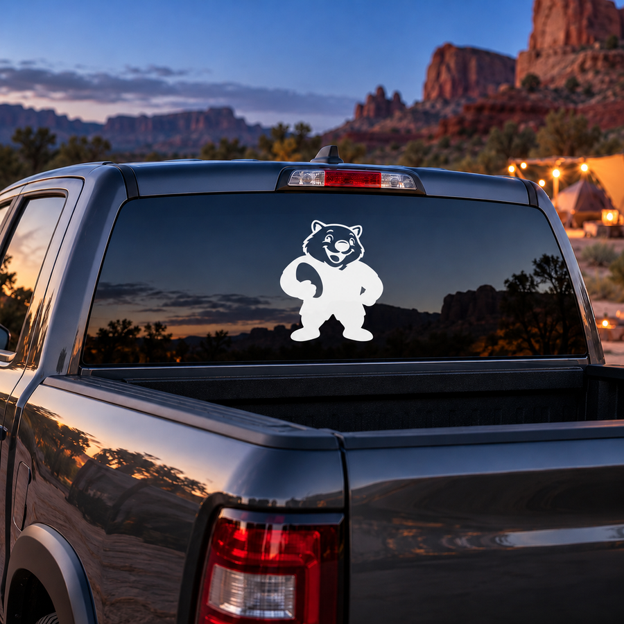 Vinyl car decal of a smiling wombat mascot, white design on dark window