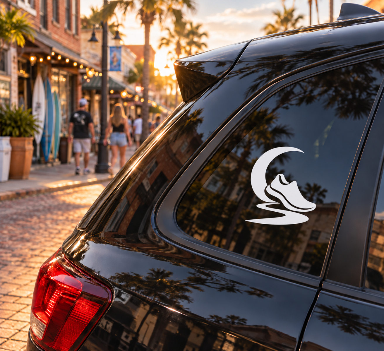 Runner vinyl decal on car window, black moon and running path silhouette