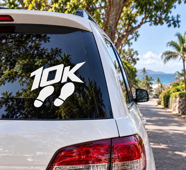 Running 10K club vinyl decal with '10K' and black footprint icons on car window