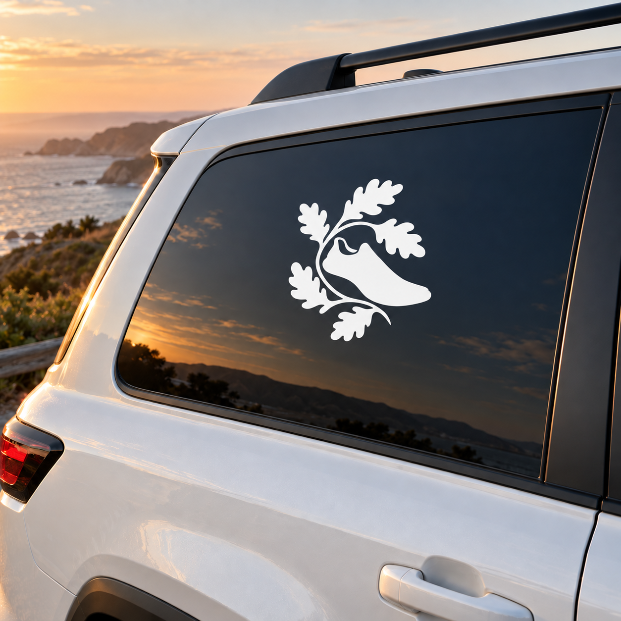 White vinyl decal of running animal with oak leaves on a dark car window panel