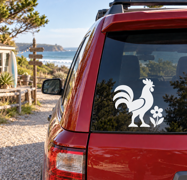 Rooster and blossom vinyl decal on a car rear window, white design on dark glass