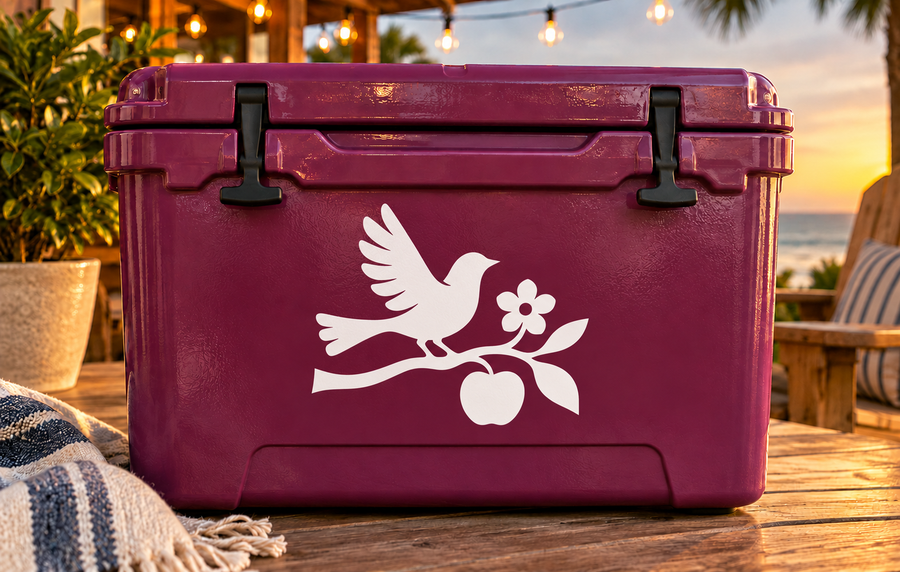Vinyl garden decal of white bird with apple and flower on dark purple surface