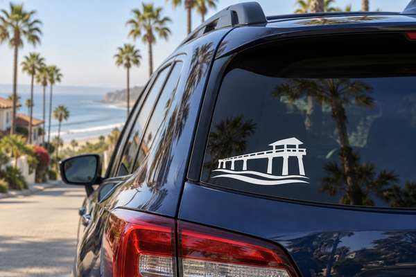 Vinyl decal of a pier silhouette with waves on a car rear window