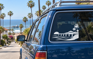 Vinyl pier sunset decal with beach, palm trees, and boardwalk graphic on car window