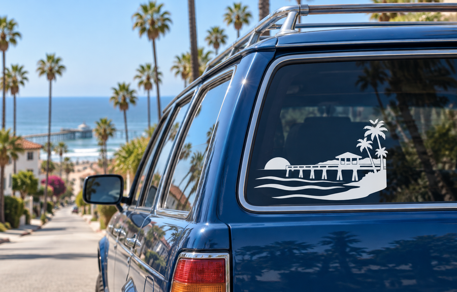 Vinyl pier sunset decal with beach, palm trees, and boardwalk graphic on car window