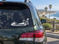 San Clemente wave and arch horizon vinyl decal, white outline on car window