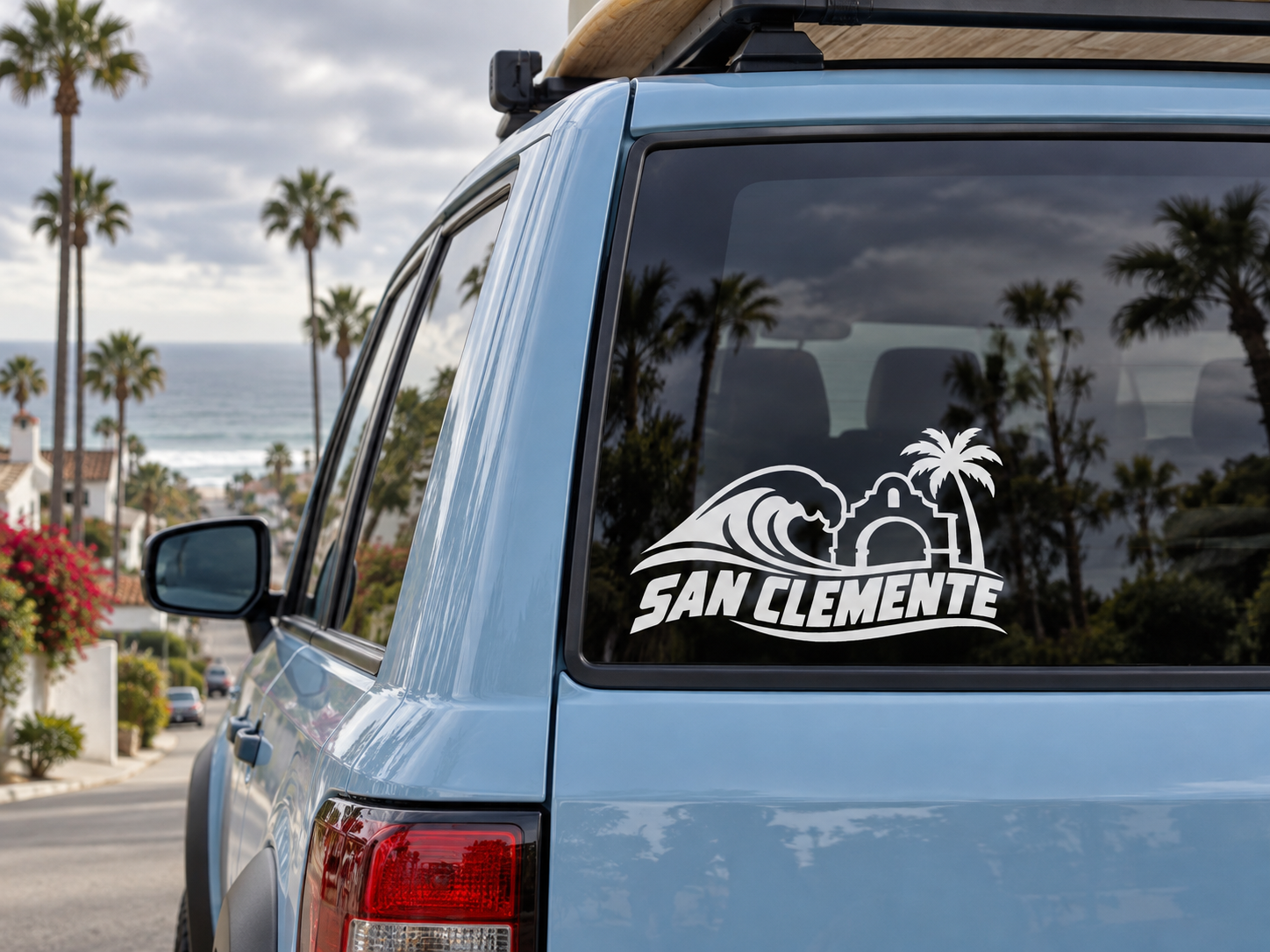 San Clemente wave and arch vinyl wordmark decal on car window, black and white