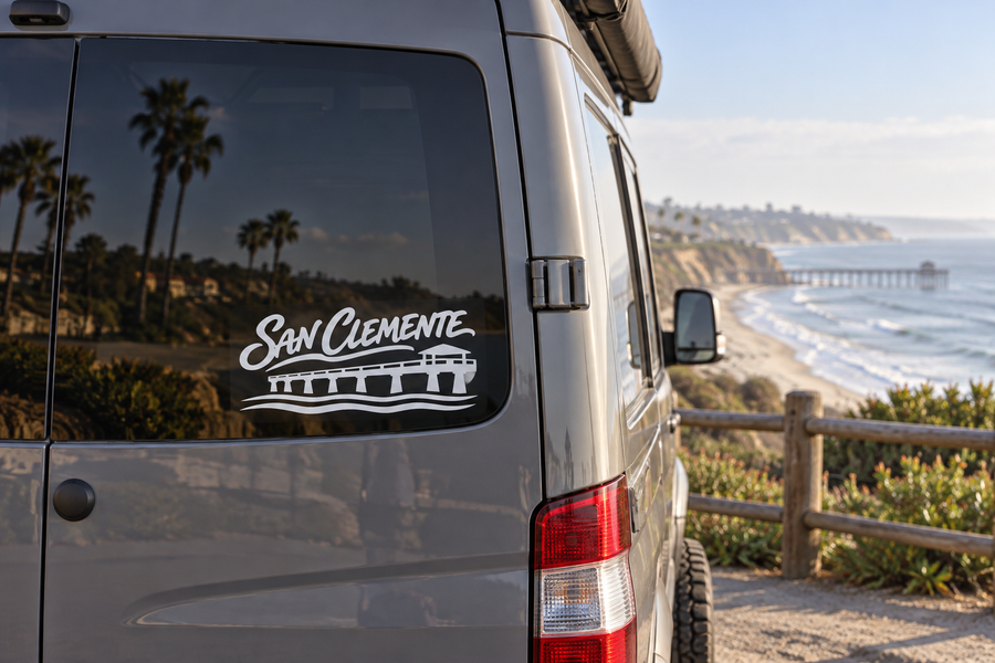 San Clemente lettering vinyl decal on vehicle rear window, black script and arch graphic