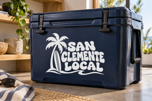 White palm tree and “San Clemente Local” vinyl decal logo on dark blue surface