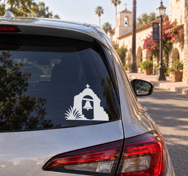 Vinyl decal featuring white mission bell icon on car rear window