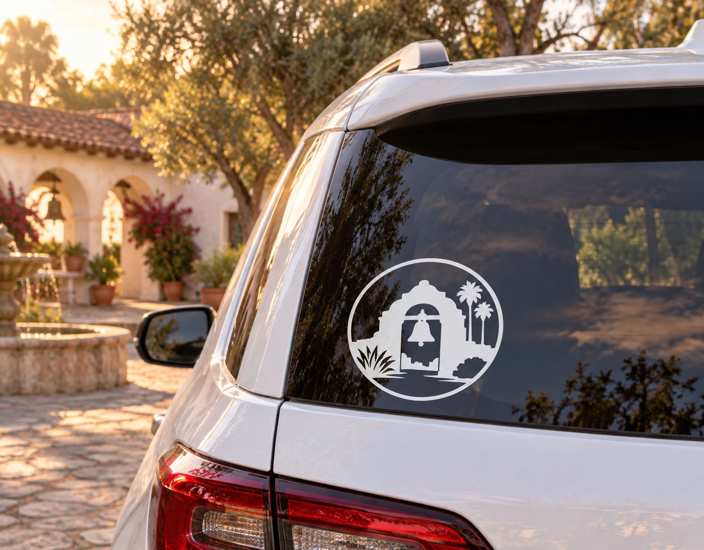 Round vinyl decal with black bell tower silhouette, palm trees, and circular border.