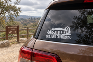 White San Juan Capistrano wordmark vinyl decal on car window