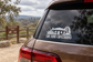 White San Juan Capistrano wordmark vinyl decal on car window