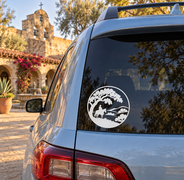 Round vinyl decal with black silhouette of horse rider under an oak tree and hills