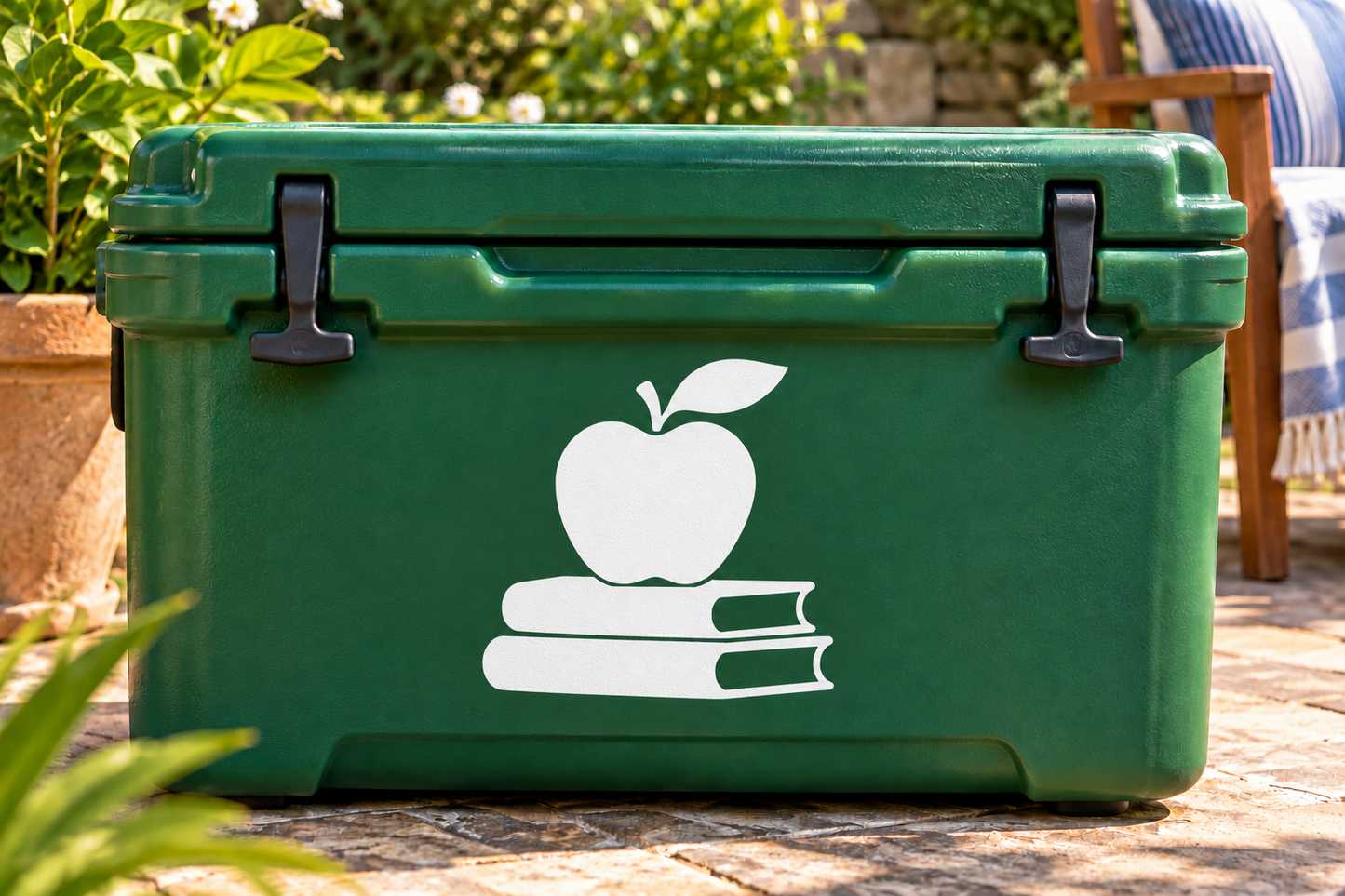 White apple over two books vinyl decal on a green case surface